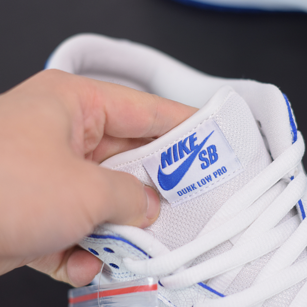 Nike sb dunk low white game royal hotsell